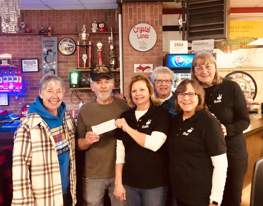 Crystal Lanes along with members of the Crystal Bowlerettes sponsored a 9-Pin Tap benefiting the Guardian Angels Saint Vincent De Paul Food Pantry, Feb. 23. A 50/50 drawing and basket raffles were held. Thirty-three ladies along with Crystal Lanes raised $525 for the Food Pantry. Pictured are, front row, from left, Louise Holmes (SVDP Food Pantry Board Member), Tom Reinke (Crystal Lanes), Beth Nelson and Terri Takala. Back row, from left, Cathy Haapala and Barb Webb.