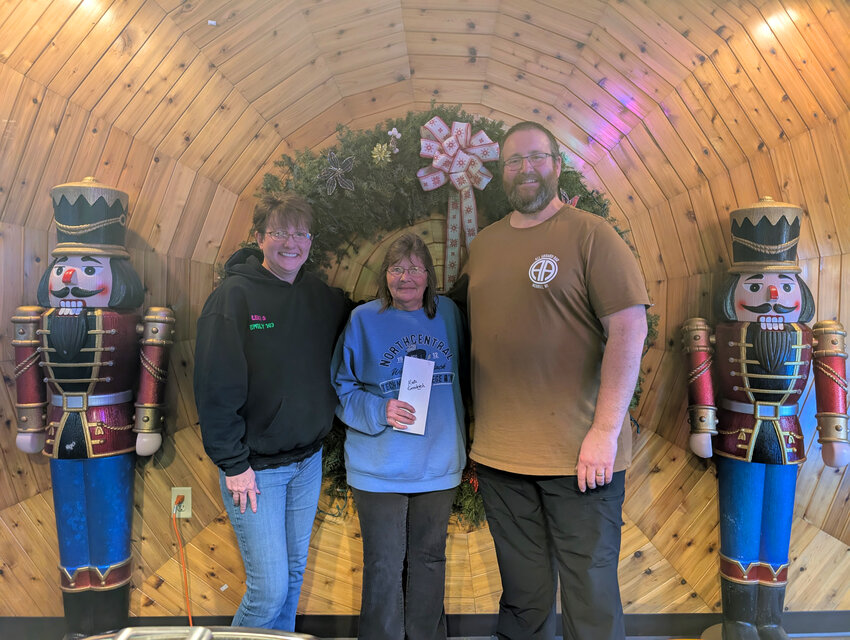Mandy, the winner of the Soup Cook Off, is pictured with Sharon, the organizer, and All Aboard Bar owner, Seth Clark.