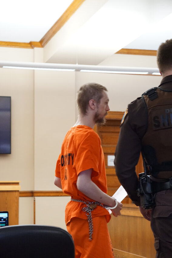 Austin David Stevenson prepares to be led from the courtroom in the custody of the Lincoln County Sheriff's Office.