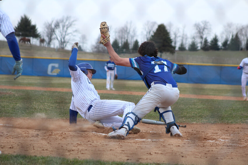 Gage Kohlmann Slides into home plate against Springs.