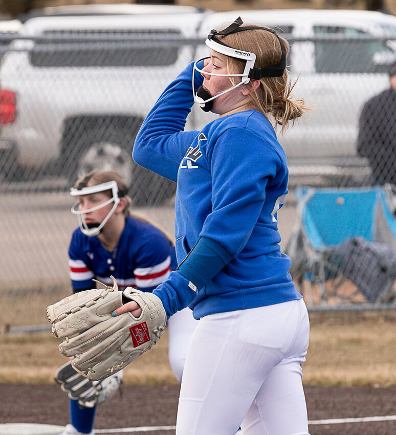Mak Herdt throws a pitch (third base player in the distance). .