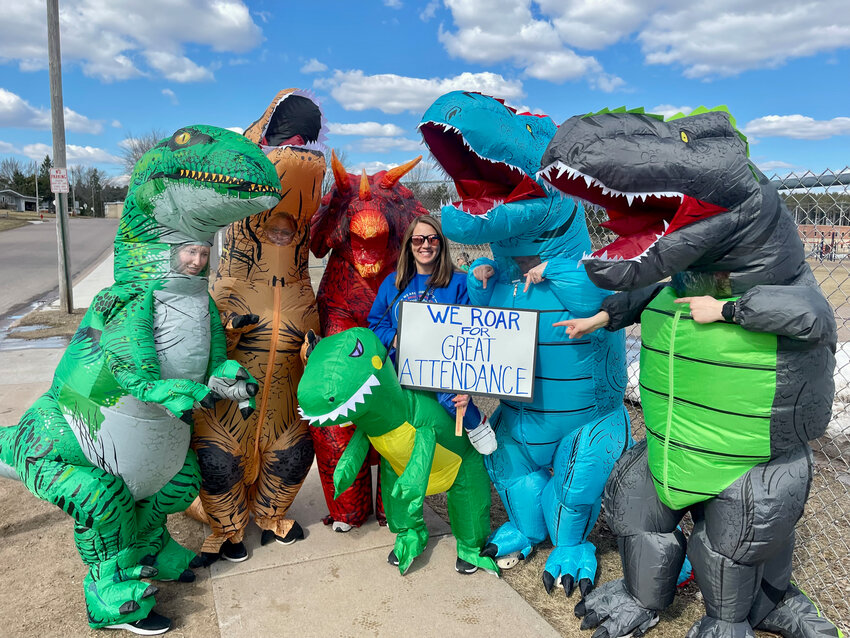 The dinosaur crew at Washington School celebrating great attendance:  "We ROAR for great attendance!"