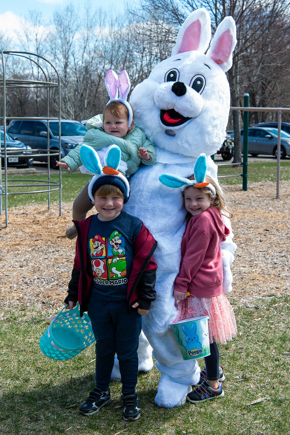 Evelynn Lynch, Evander Lynch and Izzy Winkowski get a family photo opp with the Easter Bunny prior to the Wautoma Easter Egg Hunt