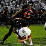 Marshfield’s Nate Beyer sacks Wisconsin Rapids’ quarterback Ben Olson during the Tigers’ loss on Friday at Beell Stadium. (Paul Lecker photo) 