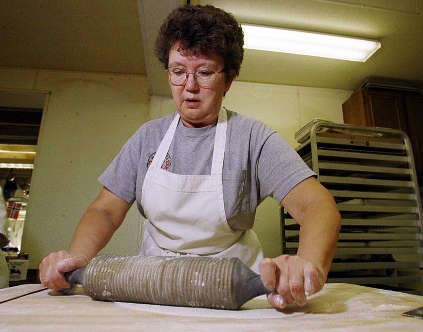 Jane Wienke rolls dough to make lefse at Wienke's Market north of Algoma in this 1999 photo. Wienke, who owned the market with her husband, Don, died Feb. 5.