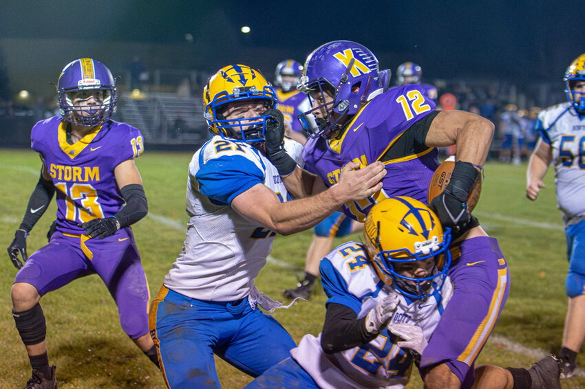 Rather than go around the defense, DJ Echols decided to go right through a few Blue Devils on his way to a big chunk of yards on Friday. Josh Staloch photo