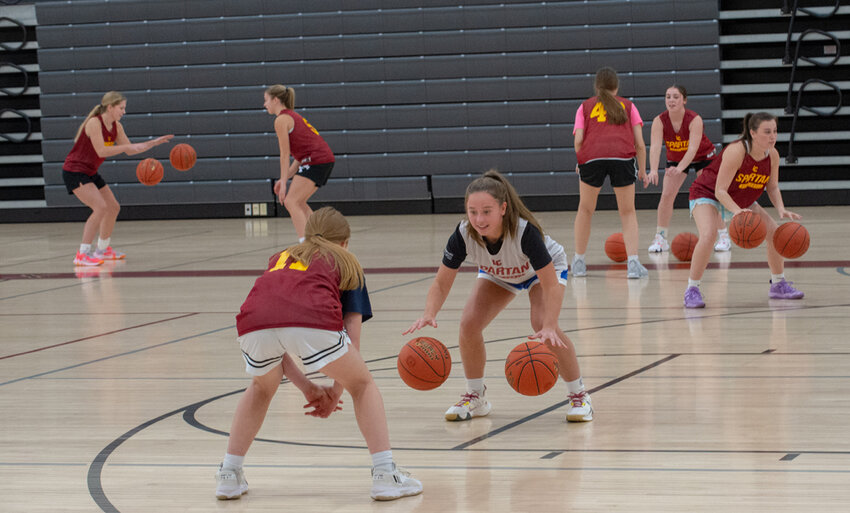 This year's L-C Spartans work on ball-handling during the first practice of the season on Monday, Nov. 6 as they get ready for the season opener against Marinette. Josh Staloch photos