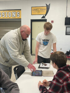 Algoma High School junior Hunter O'Hern, pictured standing on right, said that "it feels good to know that you put a smile on someone's face." Submitted photo