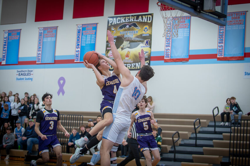 Avery Jerabek collides with Southern Door’s Caden Pierre in the lane