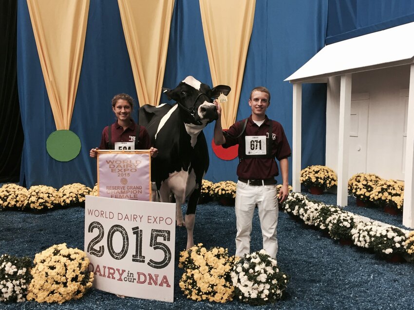 Whitney and Jordan Ebert and their winning cow, Kingsmill Atwood Allison at the World Dairy Expo.