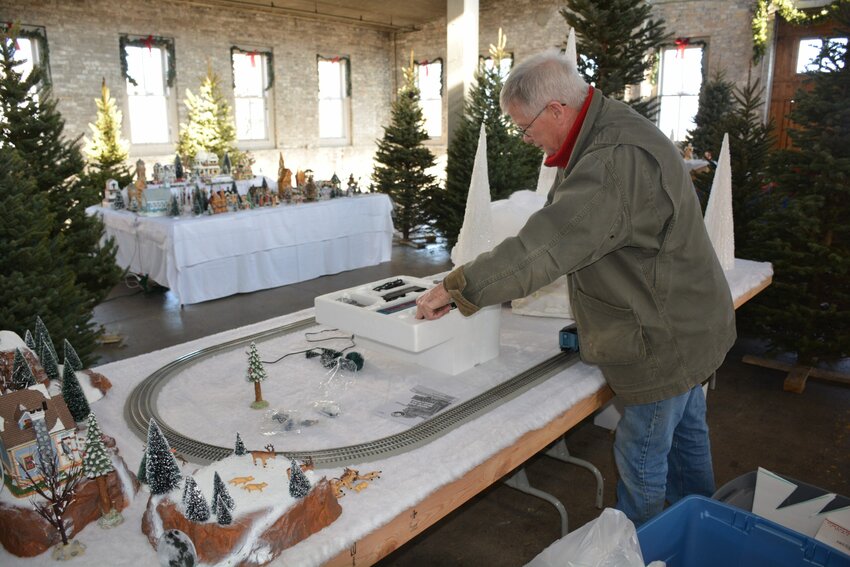 Bob Orr unpacks the Polar Express train for the Winter in the Village exhibit at Lakehaven.
