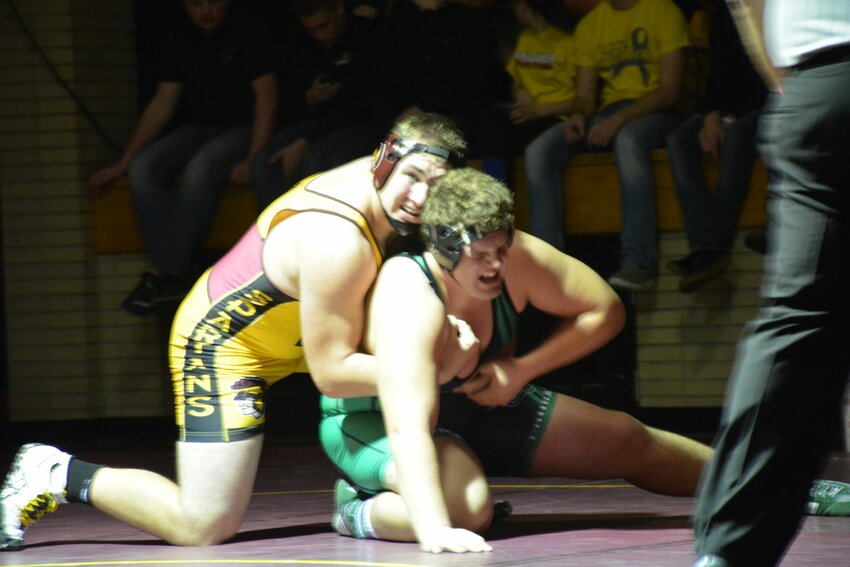 The Spartans heavyweight Phil Rasmussen takes on Coleman's Donovan Salewski at Tuesday's meet.