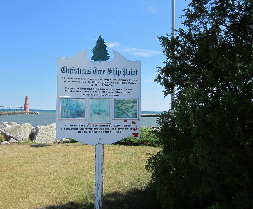 Algoma’s Christmas Tree Point serves to remind Kewaunee County of the impact it had on the Christmas tree trade in Milwaukee, Chicago and other points along southern Lake Michigan. Forty-four percent of the captains and their crews were Ahnapee/Algoma men. Including all of the Kewaunee County men boosts the percentage. That last trip in the fall, often during the storms of November, meant the difference between providing for one’s family and repairs to the ships. In an era once called the golden age of sailing, shipping was not always as lucrative as it would seem, and low incomes meant rickety ships. Such was Herman Schuenemann’s Rouse Simons. Going down in 1912, the ship and its “Captain Santa” became famous in books, songs and musical theater. The wreck was felt to be near Rowley’s Point, however it was 49 years after the Nov. 23, 1912 sinking that diver Kent Bellrichard found it while searching for another sunken ship. Two Rivers Maritime Museum has artifacts, and Algoma honors the memories of those such as Sibilsky, Henry, McDonald, Armstrong, Nelson and more, and the 52 Christmas Tree ships felt to pass the city taking Tannenbaums to the immigrants who depended on the ships. More on the Christmas Tree ships can be found in any public library.