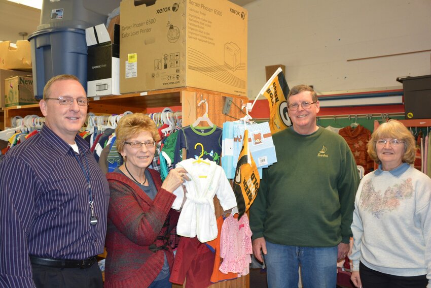 (Left to right) Jim LaCourt with Helping Hands, Donna Monahan, Dan Balch and Gail Herlache with the Clothing Closet.  The used clothes store, Helping Hands and Energy Services of Kewaunee County will all be moving to space at 416 Harrison St. in Kewaunee prior to May 1.