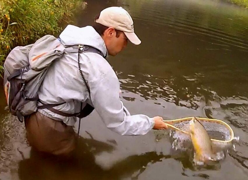 Dan struggles to net a large trout.