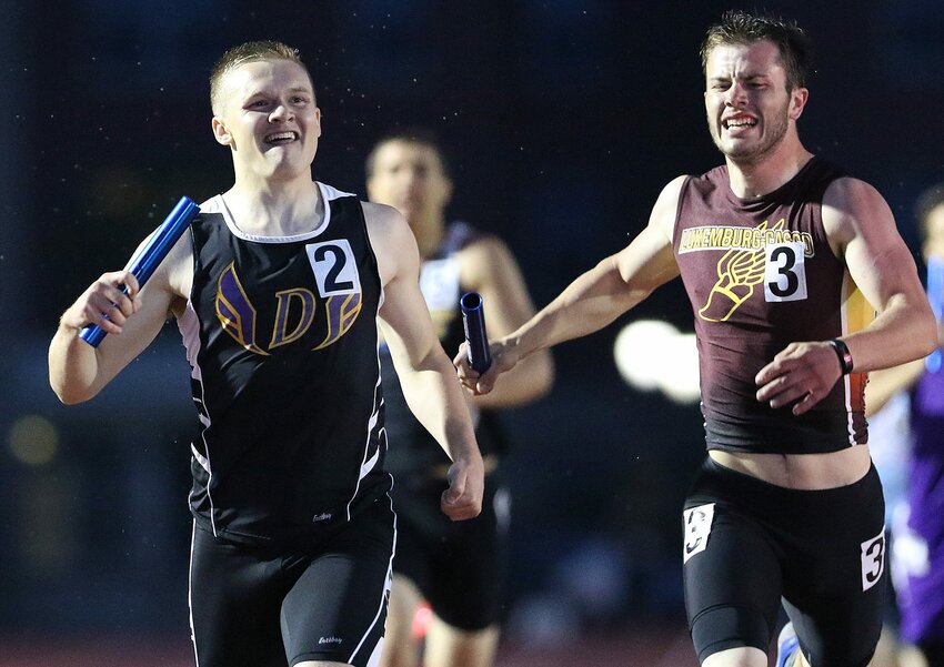 Denmark's Zachary Pantzlaff, left, and Luxemburg-Casco's Sam Larson compete in the WIAA Division 3 1600 meter relay at the state track and field meet June 3, at the Veterans Memorial Stadium Complex in La Crosse.