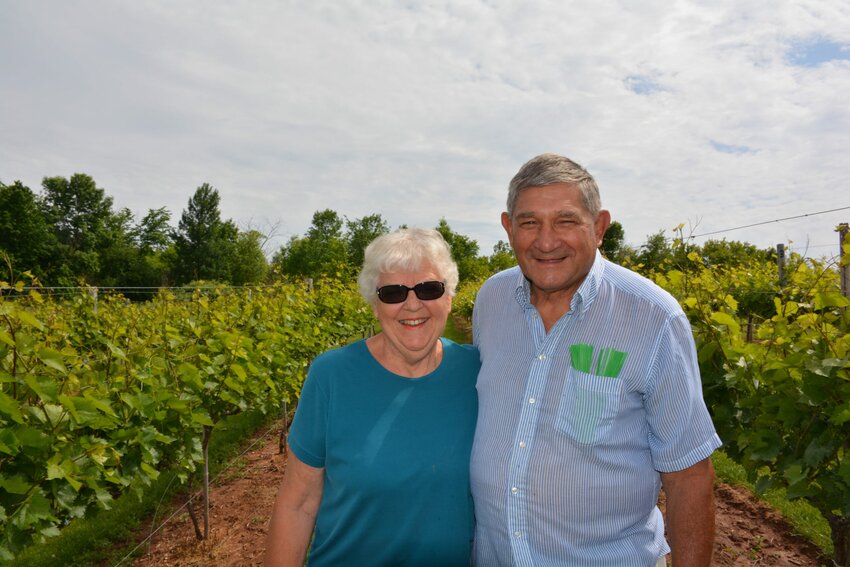 Sandie and Mark Lefebvre in their Red River Vineyard.