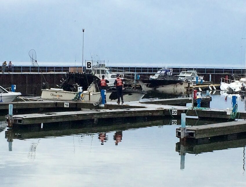 Three boats sank and two other sustained serious damage Thursday in a fire at Algoma Marina.