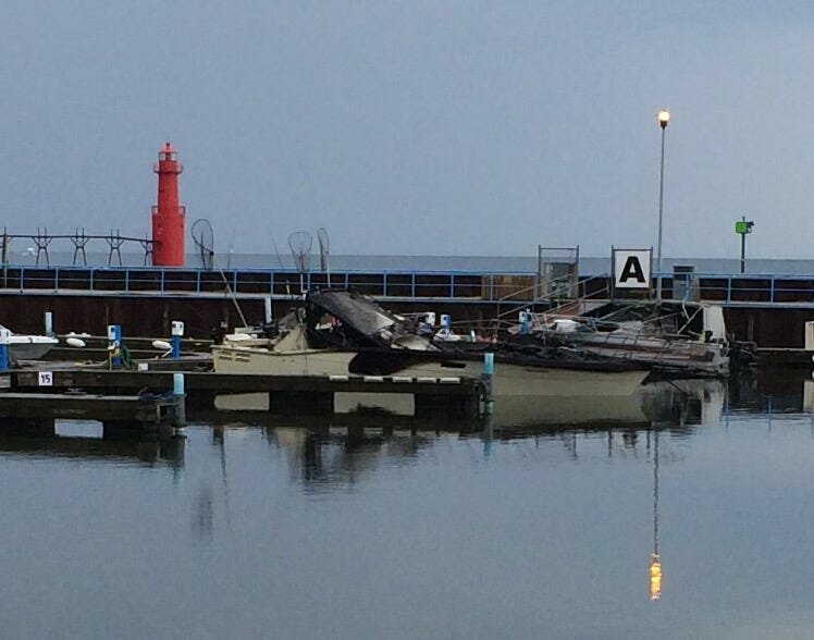 Four boats belonging to a single owner in slip A were damaged by fire early Thursday; three sank.