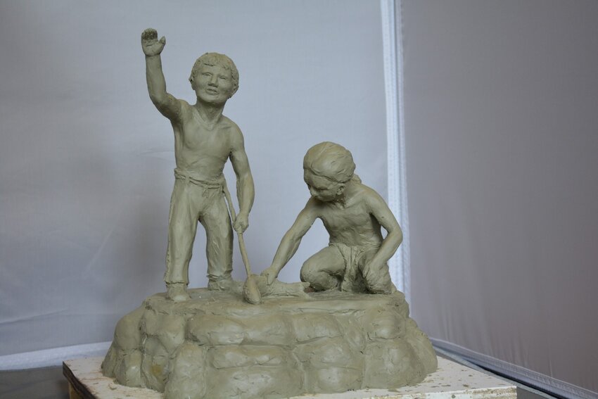 Dr. Faller's sculpture portrays two Menominee Indian boys who have just speared a fish.