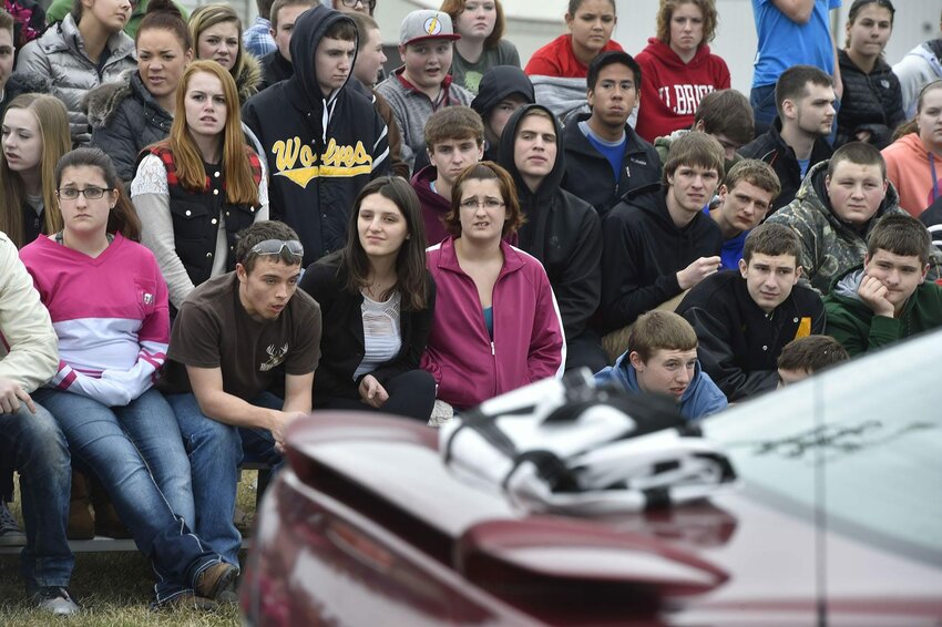 Algoma High School students look on with shock and dismay at the accident scene.