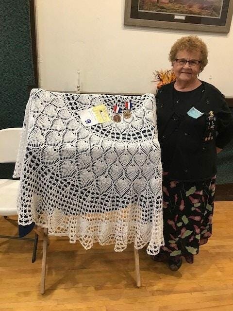 Anita Schuller of Kewaunee County Home and Community Education received two medallions for a crocheted table cloth she entered in the Cultural Arts competition at the HCE state conference in September.