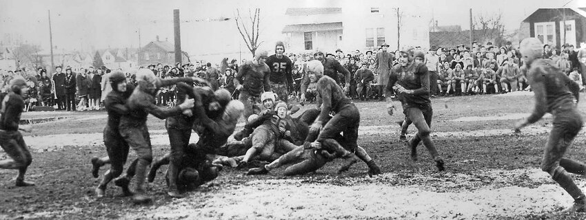 SNAPSHOT IN TIME: It was 1950 and the “Z-Bomb” put Algoma on the map. He also led his teammates to the greatest football upset of the year. The “Z-Bomb” was Bob Zastrow, known as “Zug” in Algoma. As a junior Midshipman at the U.S. Naval Academy in December 1950, he led his team to a 14-2 victory over Army. One paper called it a “preposterous upset” as Navy had only two other wins that season before beating the country’s No. 2 ranked team while his folks, sister, his Algoma girlfriend and President Harry Truman were in the stands. It was said there were few in Algoma who weren’t at their radios that Saturday. The New York Times wrote about the redhead from Algoma whose name was plastered in newspapers across the country and Majestic Theater owner Roger Reinert got films of the game to be shown locally. Associated Press called the young quarterback “The Pride of Algoma,” and he was. In another local twist, former Kodan resident Cadet Stanley Kuick played for Army. The football photo, from the 1940s, is from the Heidmann Collection at the Algoma Public Library.