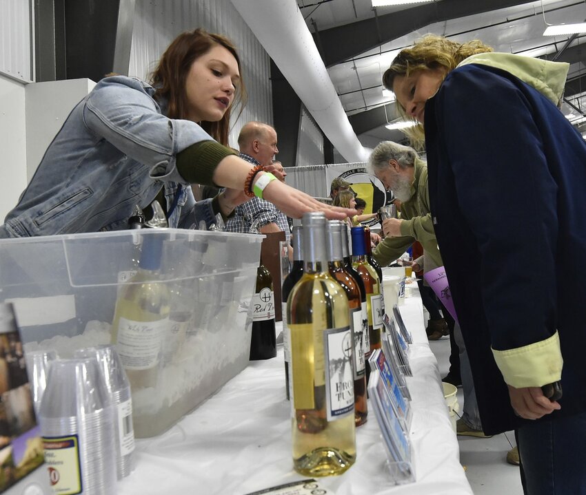 Wine was featured along with craft beer at Roar off the Shore Brewfest. Here, Maryssa Paulsen of Parallel 44 Vineyard & Winery in Kewaunee, explains the characteristics of its wine assortment to guests.