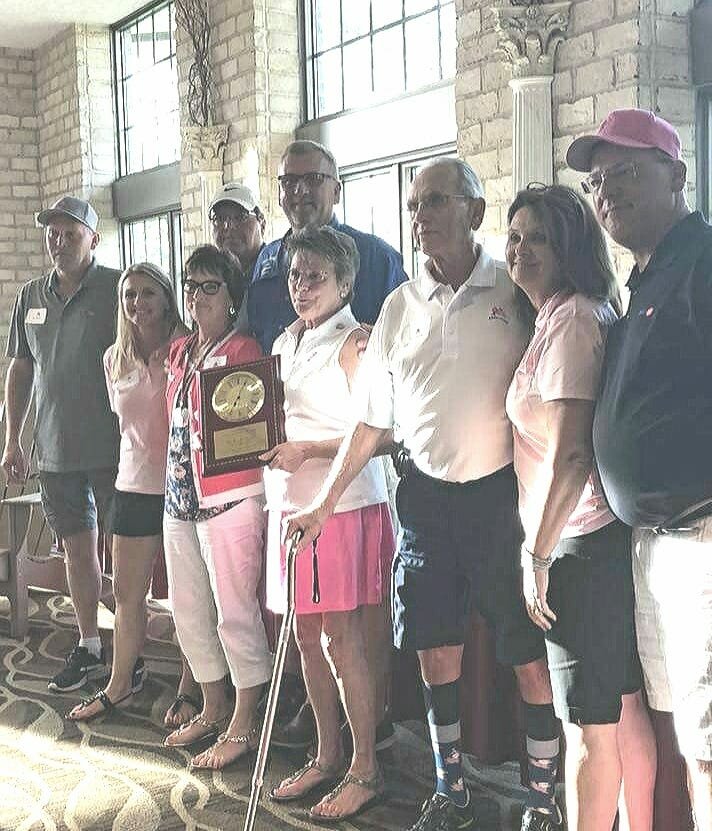 The Rueckl family was given Ribbon of Hope's annual Warrior Award, granted to an individual or group who is extremely helpful and supportive of the organization's mission. Accepting the award are, from left, Tim Rueckl, Jeff and Lynn Rueckl, Dave and Gail Rueckl, Ribbon of Hope co-founder Linda Rueckl and her husband, Tom,, and Nikki and Ribbon of Hope president Tom G. (Bomber) Rueckl.