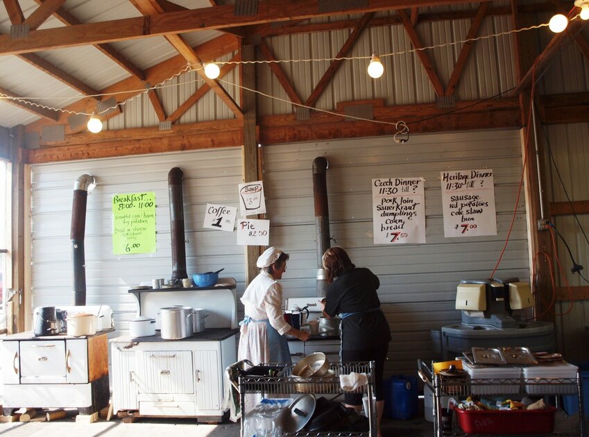 Volunteers cook food to be served at Agricultural Heritage Days on these old-fashioned, wood-fueled cookstoves that are considered one of the highlights of the event.