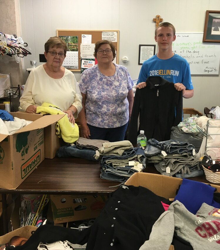 James Cullen, Jr., right, has launched his third annual Weather Warm-Ups youth clothing drive in Kewaunee County. Shown with Cullen are, from left, Jeanette Guns and Sharon Anderson of the Kewaunee Community Clothing Closet, one of the local nonproft organizations receiving items from the drive.
