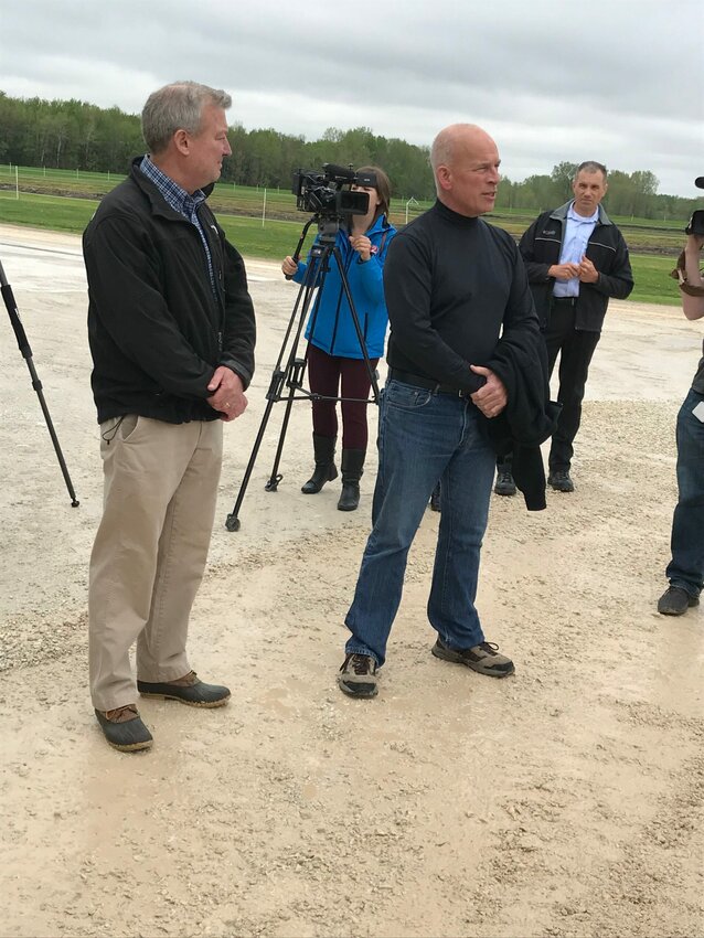 Peninsula Pride Farms President Don Niles gives opening remarks Tuesday, May 28, 2019, before a tour with Gov. Tony Evers and state Rep. Joel Kitchens, left, of Deer Run Dairy in Kewaunee.