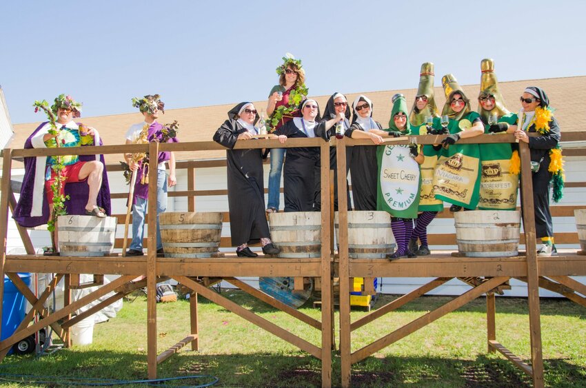 Nuns, bottles of sparkling wine and apparently two kings of the grape get ready for the wine stomp at Wet Whistle Wine Fest at von Stiehl Winery in Algoma. A number of the 2,000 or so guests to the festival wear costumes which aren't mandatory but definitely encouraged.