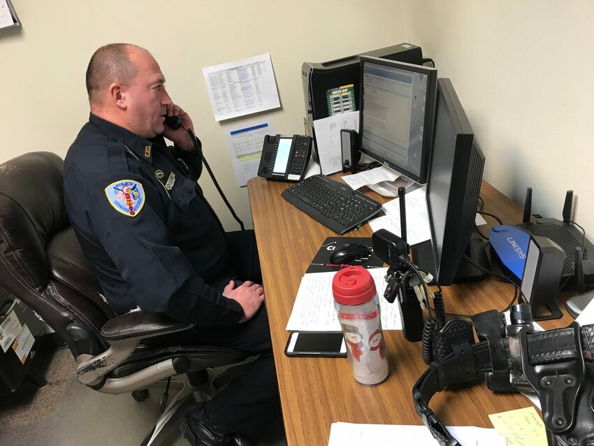 James Kleiman Jr. takes a call at the Kewaunee Police Department. Kleiman will become the department's police chief Jan. 3.