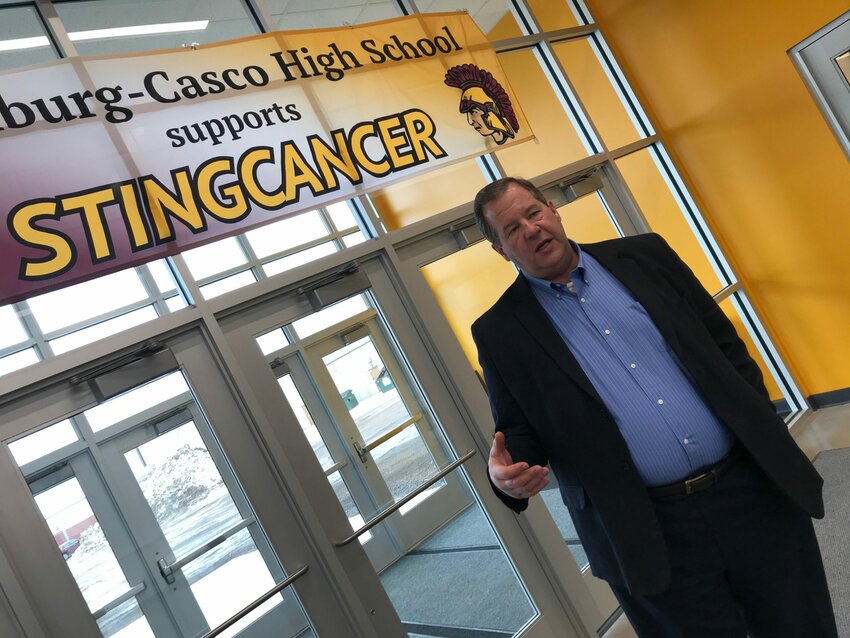 Luxemburg-Casco School District Sup. Glenn Schlender talks about the benefits of the new school gymnasium in the entrance to the gym.