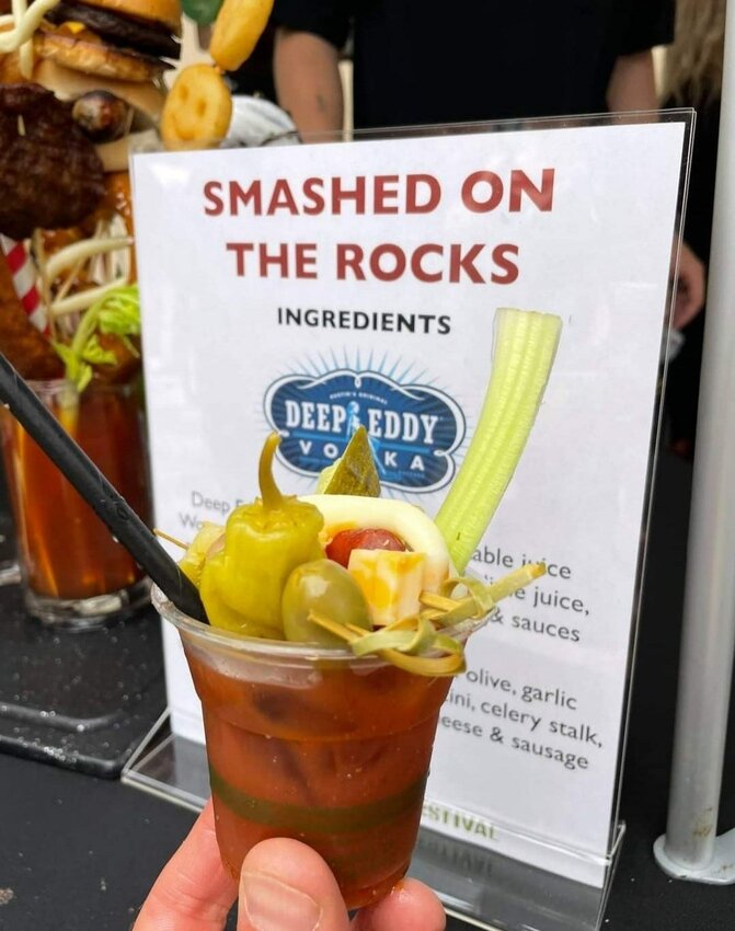 One of the bloody marys made by Smashed on the Rocks Saloon in Algoma that won first place in People's Choice voting at The Bloody Mary Festival held Aug. 21 in Milwaukee. The Smashed on the Rocks version also won second place from the festival judges for best original recipe and best garnish. In the background is an example of the loaded bloody marys the bar serves on weekends.