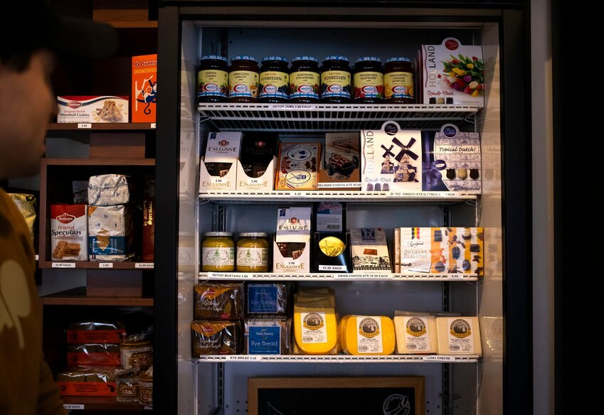 Sergii Aleksieiev points out products in Wakker Cheese, Monday, March 7, 2022, at 409 Milwaukee St. in Kewaunee, Wis. Wakker Cheese is sending 100% of proceeds from all sales to Ukrainians amid a Russian invasion.
