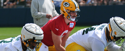 Packers Backup Quarterback Sean Clifford takes a snap during the first day of Training Camp. Tori Wittenbrock photos