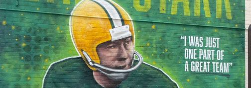 The mural is located on the side of the historic Bellin Building at 103 E. Walnut St., Green Bay, adjacent to the recently renamed Bart Starr Memorial Bridge. Eva Westein photo