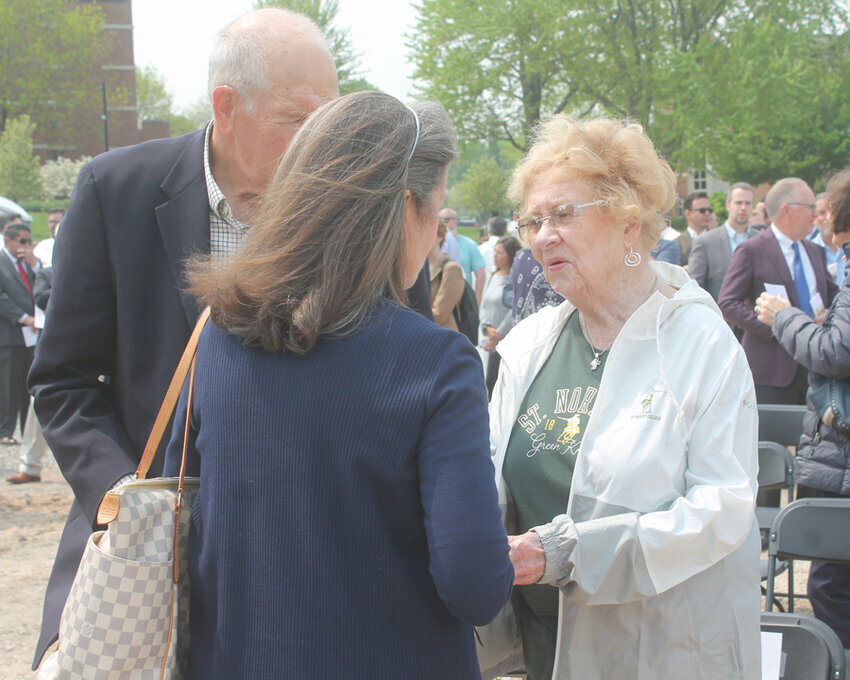 </p><p>Patricia Schneider visits with attendees following the ceremony to kick off construction of the Donald & Patricia Schneider Family Hall