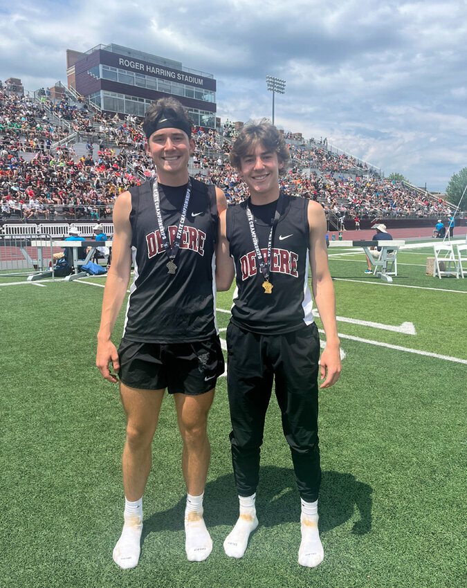 Aiden Cartier, left, and his younger brother, Andrew Cartier, right, took first and second place in the triple jump at the State Tournament, respectively. Doug Etten photo