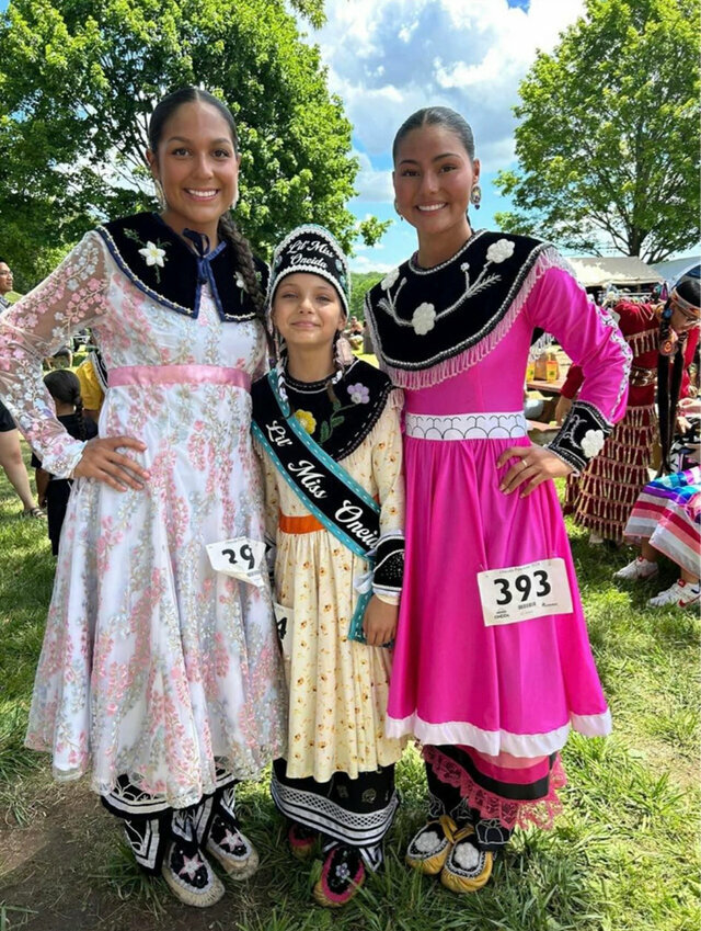 From left, Muñca Danforth, Lil Miss Oneida Lucia Stevens and Riley Aguirre dressed in regalia for the 50th annual pow wow. Tana Aguirre photo