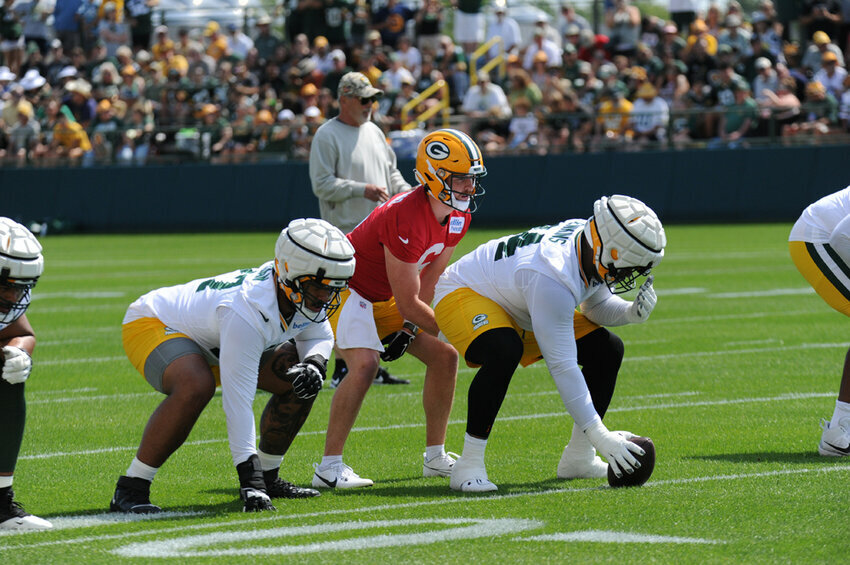 Packers Backup Quarterback Sean Clifford takes a snap during the first day of Training Camp. Tori Wittenbrock photos