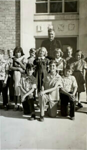 A group of children pictured outside of the orphanage