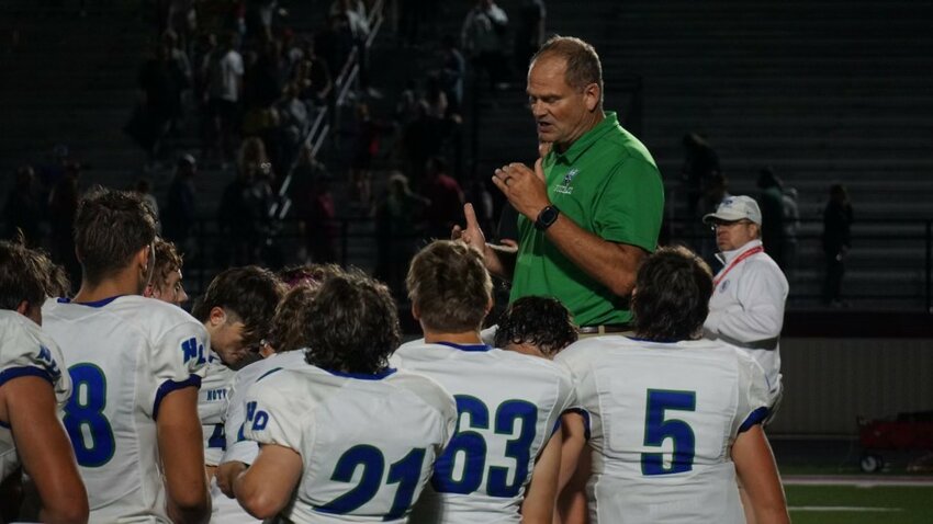 Notre Dame Academy Head Coach Mike Radar has a pep talk with his team.