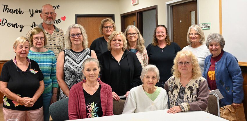 Juel Krueger, front row center, along with her crew of rosemalers get together to celebrate recent rosemaling achievements received through the Vesterheim Museum in Iowa..Emily Conroy Photo