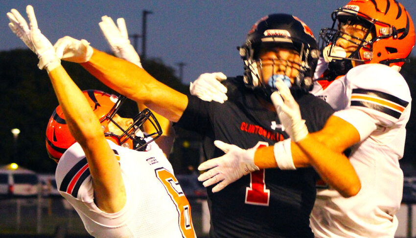 Ripon's Carter Kissinger (left) and Declan Dudzinski break up a pass intended for Clintonville's Sam Wegener Aug. 30. Wegener caught 10 passes for 154 yards and scored four of the Truckers'  six touchdowns in a 43-20 win over the Tigers..Greg Seubert Photo