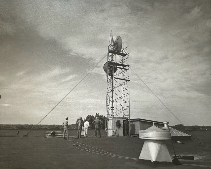 Working on the antenna in the 1950s. WLUK photo