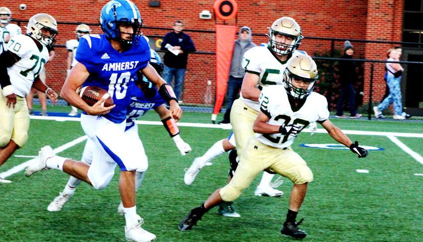 Amherst quarterback Michael Glodowski heads for the end zone to score the Falcons' first touchdown Sept. 6 in a 41-20 win over Colby..Greg Seubert Photo