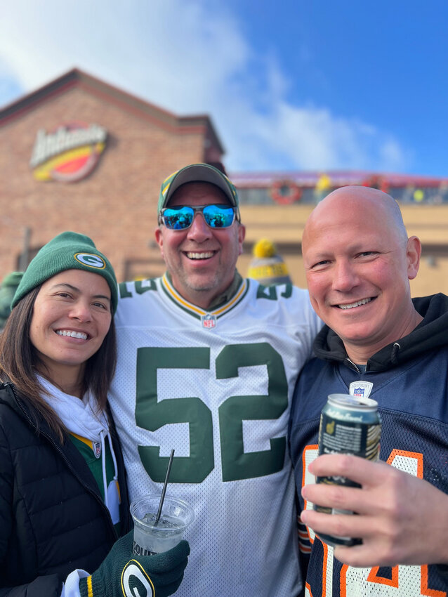 Petersen with her husband and brother on a beautiful game day at Lambeau Field.